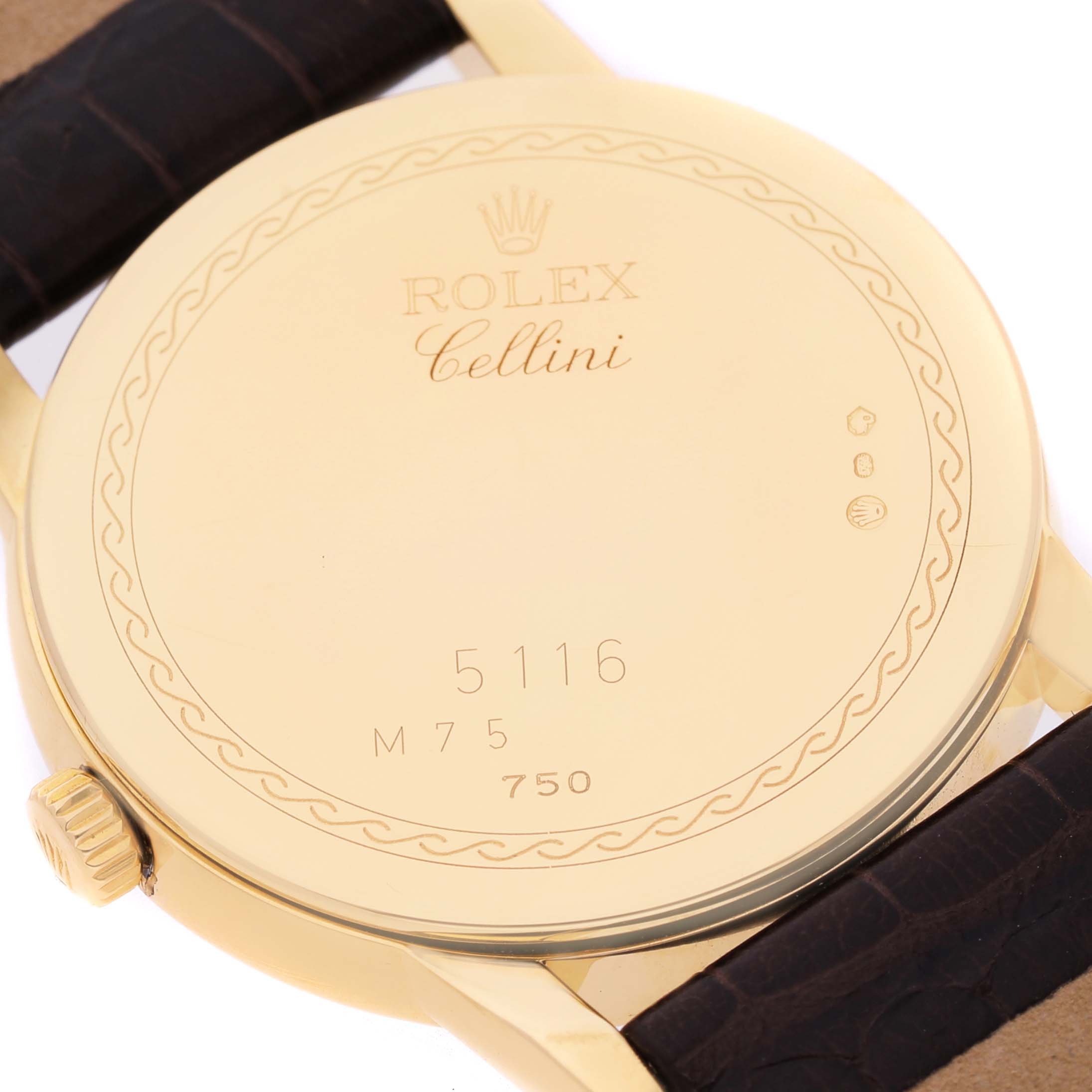 The image shows the back case of a Rolex Cellini 5116/8 Men's Yellow Gold Silver Dial watch at a slight angle, highlighting the brand engraving and strap.