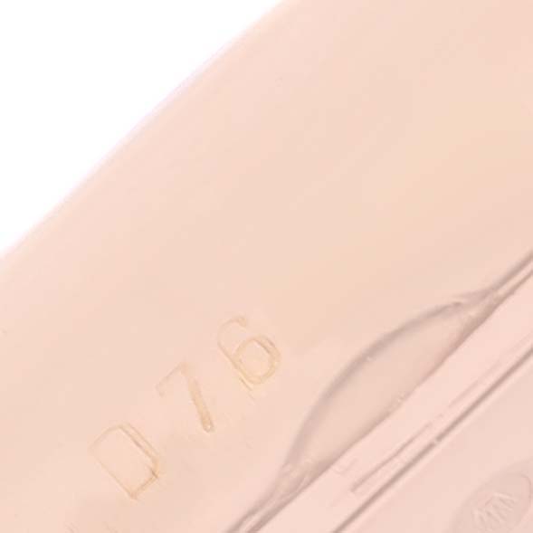 This image shows an extreme close-up of part of the case of a Rolex Cellini 5442 Men's Rose Gold Black Dial 5442 Men's Rose Gold Black Dial watch, revealing engraved markings.