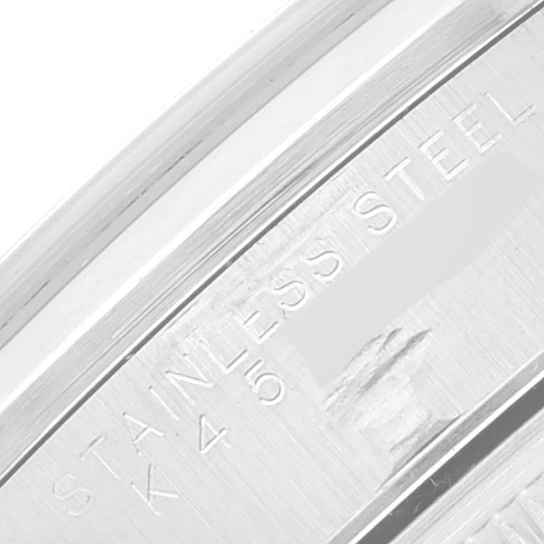 The image shows a close-up of the side, showing the engraved "Stainless Steel" of a Rolex Date 15200 Men's Stainless Steel Black Dial 15200 Men's Stainless Steel Black Dial model.