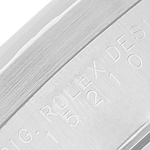 The image shows an extreme close-up of the inner bezel with engraving for a Rolex Date 15210 Men's Stainless Steel Blue Dial 15210 Men's Stainless Steel Blue Dial model watch.