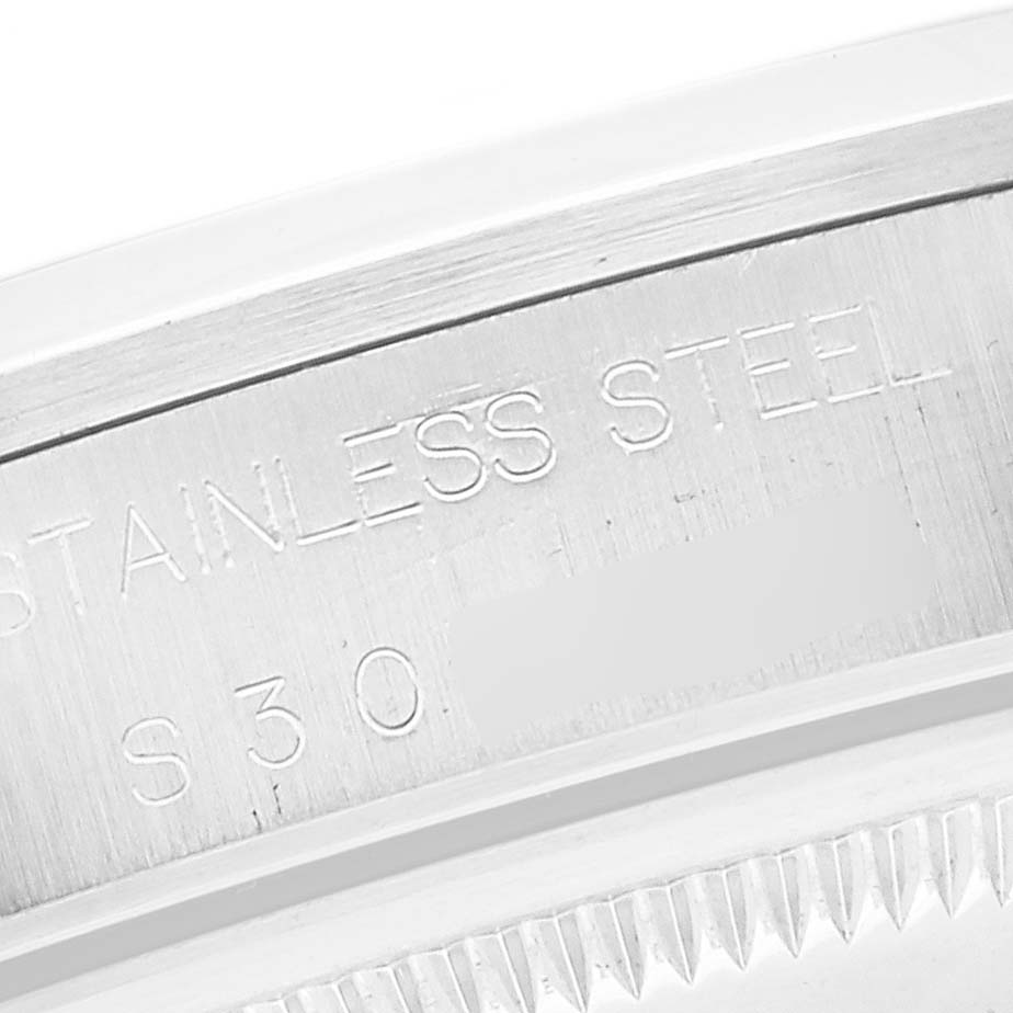 This image shows a close-up of the case back edge and the engraved "STAINLESS STEEL" marking of a Rolex Date 15200 Men's Stainless Steel White Dial 15200 Men's Stainless Steel White Dial model.