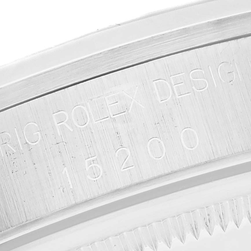 The image shows a close-up of the engraved caseback of a Rolex Date 15200 Men's Stainless Steel White Dial 15200 Men's Stainless Steel White Dial model watch.