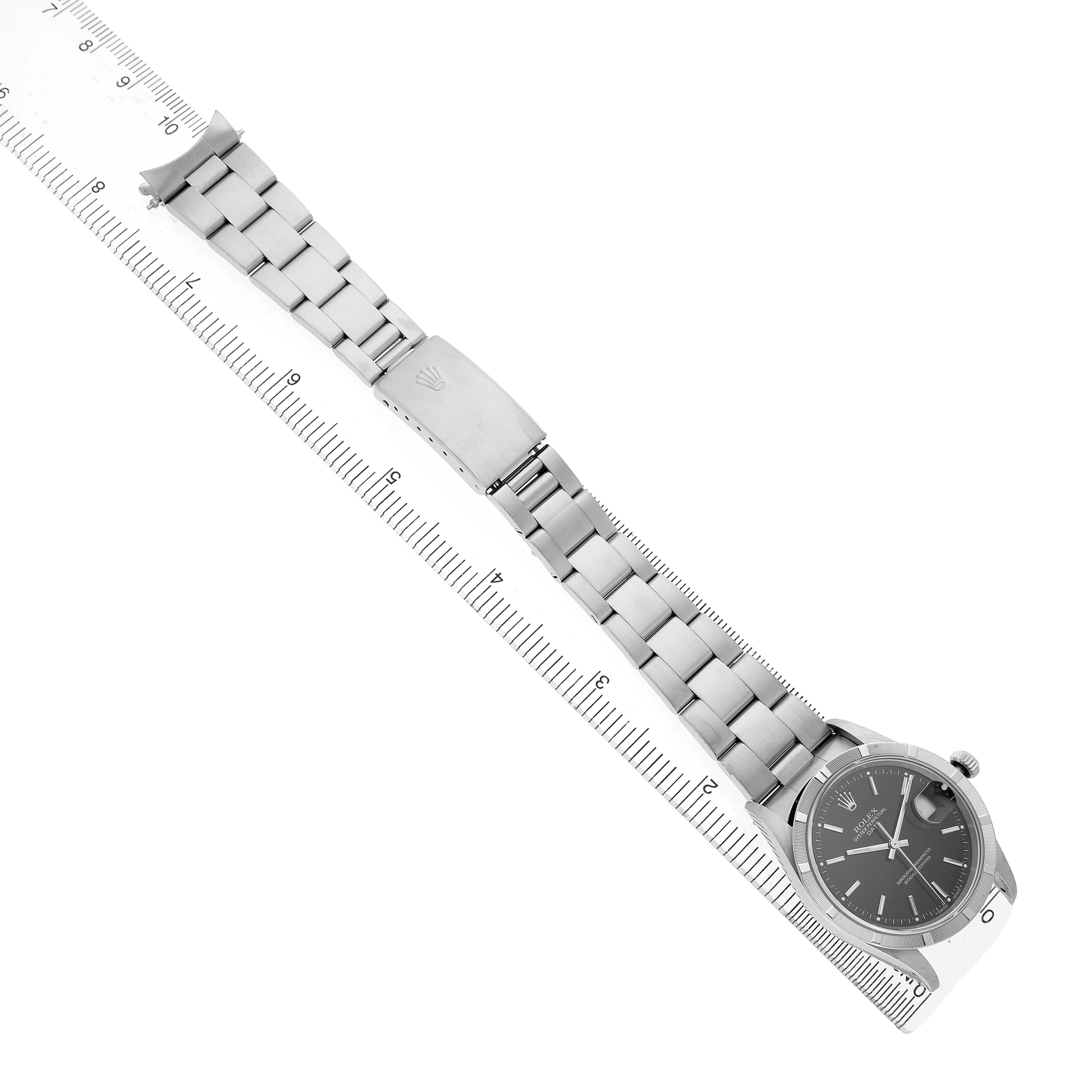 The Rolex Date 15210 Men's Stainless Steel Black Dial watch is displayed at a diagonal angle, showing the face, bracelet, and clasp.