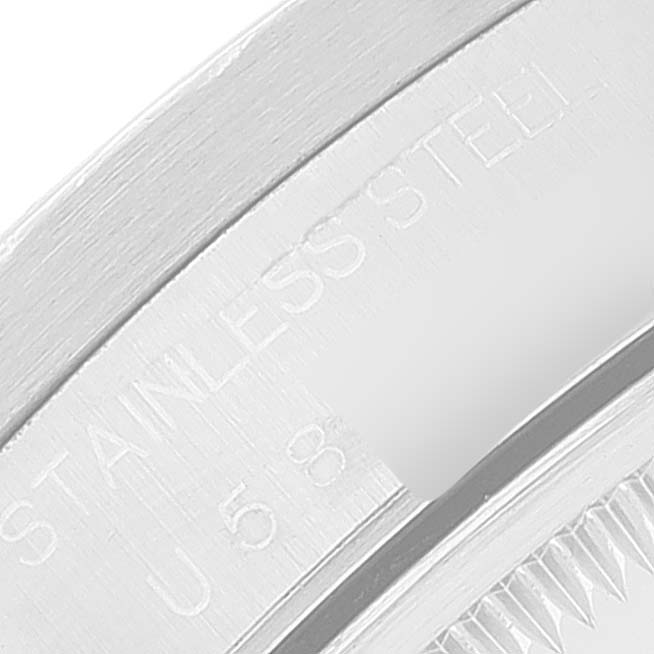 This image shows a close-up of the case back edge and serial number engraving of a Rolex Date 15210 Men's Stainless Steel White Dial 15210 Men's Stainless Steel White Dial model watch.