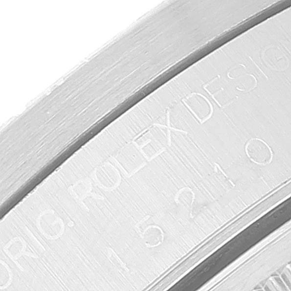 This close-up angle shows the bezel engraving of a Rolex Date 15210 Men's Stainless Steel White Dial 15210 Men's Stainless Steel White Dial watch, including "ROLEX DESIGN" and a partial reference number.