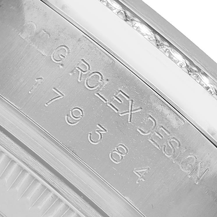 The image shows a close-up of the inner bezel with engraved text of the Rolex Datejust 179384 Women's Stainless Steel Silver Dial model.