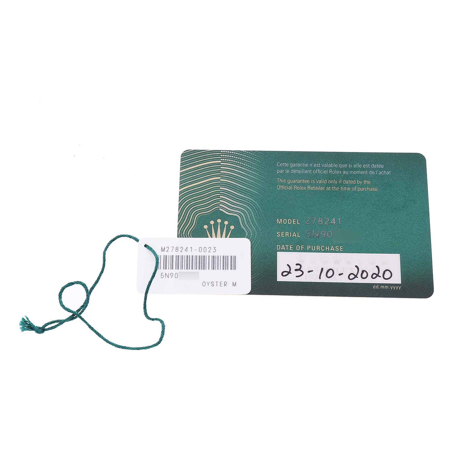 The image shows a green warranty card and a tag for the Rolex Datejust 278241 Women's Stainless Steel Pink Dial model, both lying flat.
