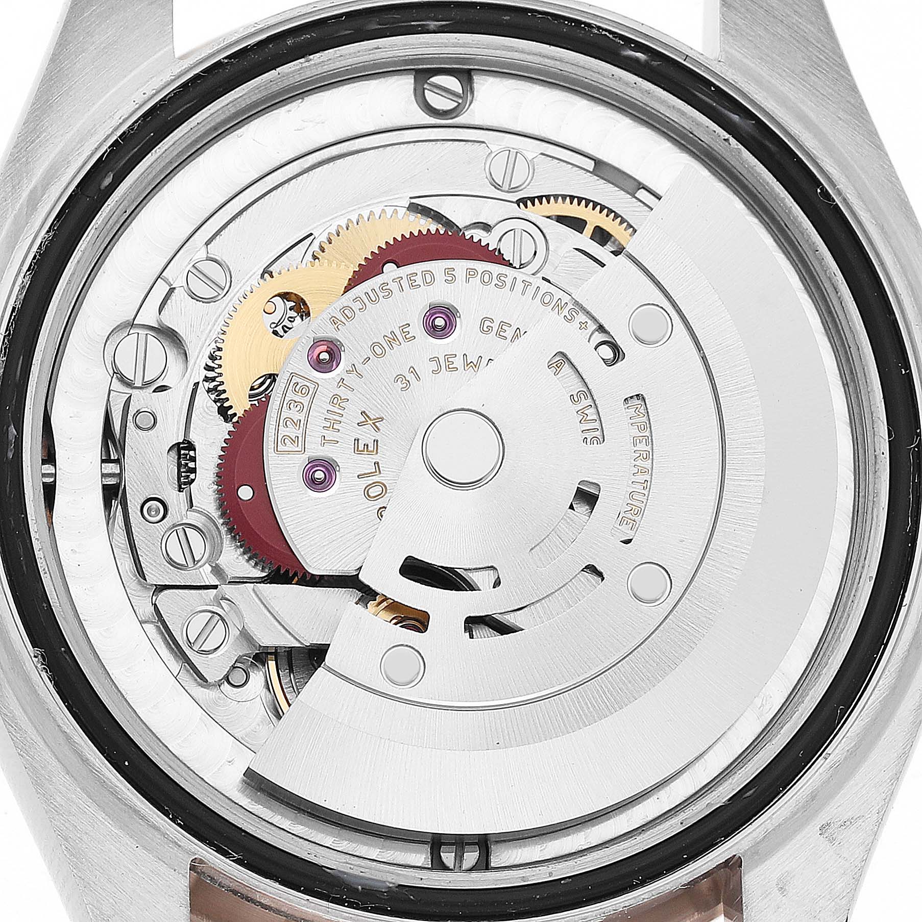 The image shows the mechanical movement of a Rolex Datejust 278241 Women's Stainless Steel Pink Dial watch from a rear view, highlighting gears and the rotor.
