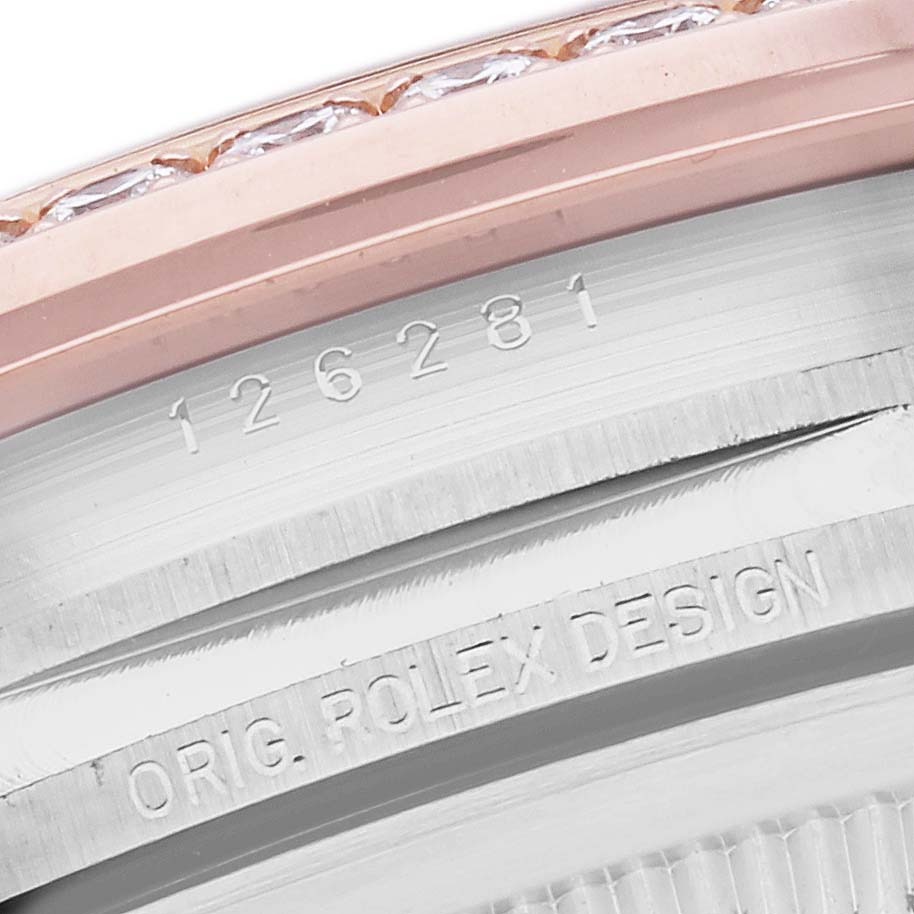 The image shows a close-up of the edge of a Rolex Datejust 126281 Men's Steel and Gold (two tone) Grey Dial 126281 Men's Steel and Gold (two tone) Grey Dial watch, highlighting the bezel and engraved serial number.