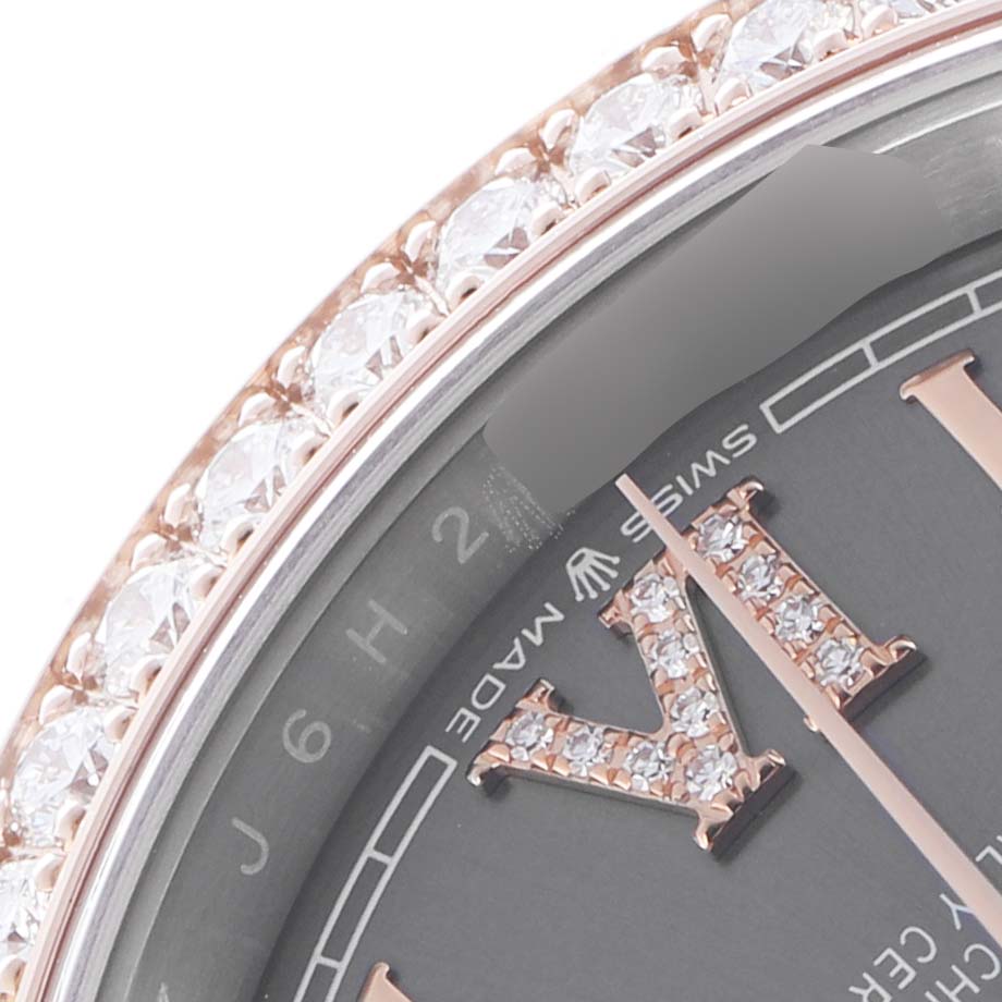 The image shows a close-up of a Rolex Datejust 126281 Men's Steel and Gold (two tone) Grey Dial 126281 Men's Steel and Gold (two tone) Grey Dial watch bezel adorned with diamonds, highlighting the dial and part of a Roman numeral.