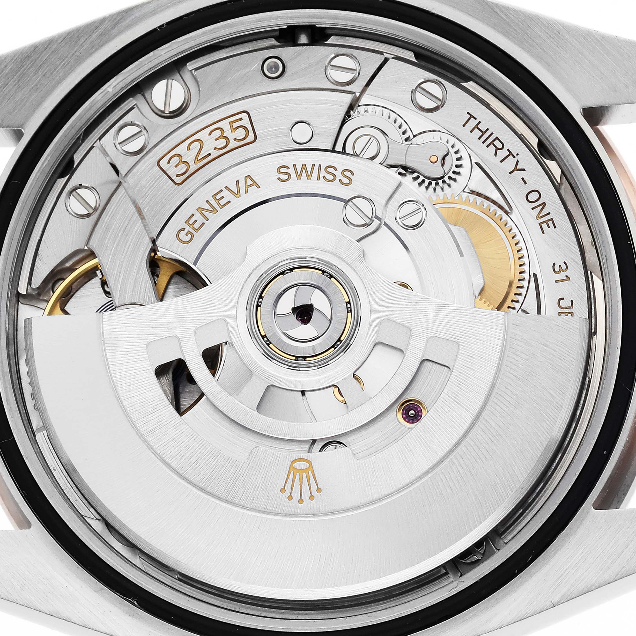 The image shows a close-up of the movement inside a Rolex Datejust 126281 Men's Steel and Gold (two tone) Grey Dial 126281 Men's Steel and Gold (two tone) Grey Dial, highlighting the rotor and intricate mechanisms.