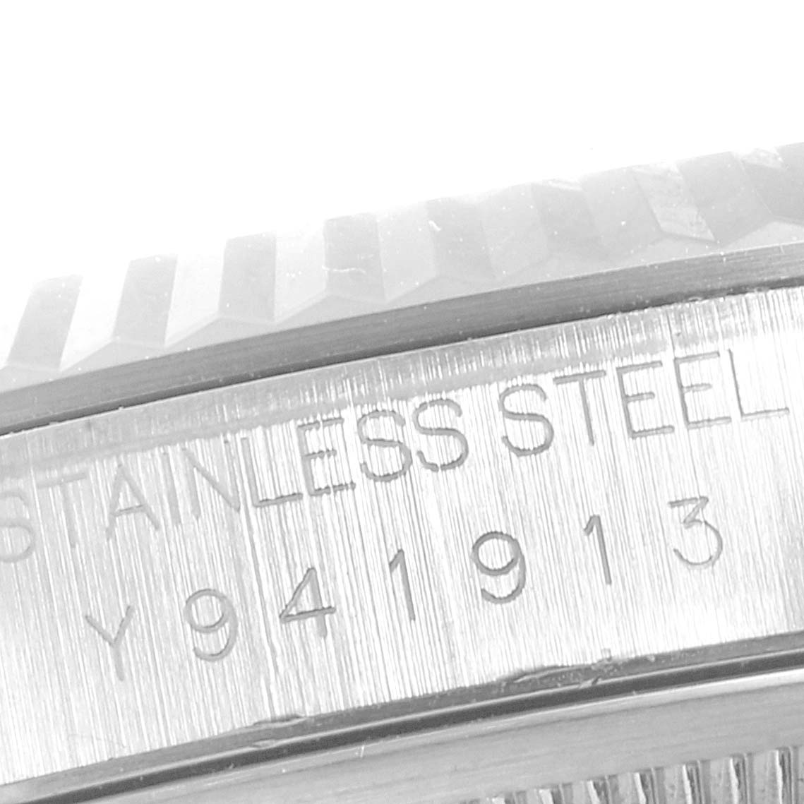 This image shows a close-up angle of the serial number engraving on the Rolex Datejust 16234 Men's Stainless Steel White Dial 16234 Men's Stainless Steel White Dial watch's stainless steel case.