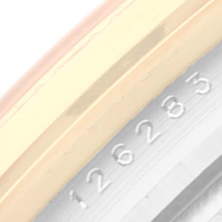 The image shows a close-up of the Rolex Datejust 126283 Men's Steel and Gold (two tone) Mother of Pearl Dial 126283 Men's Steel and Gold (two tone) Mother of Pearl Dial model's bezel and case, highlighting the engraved serial number.