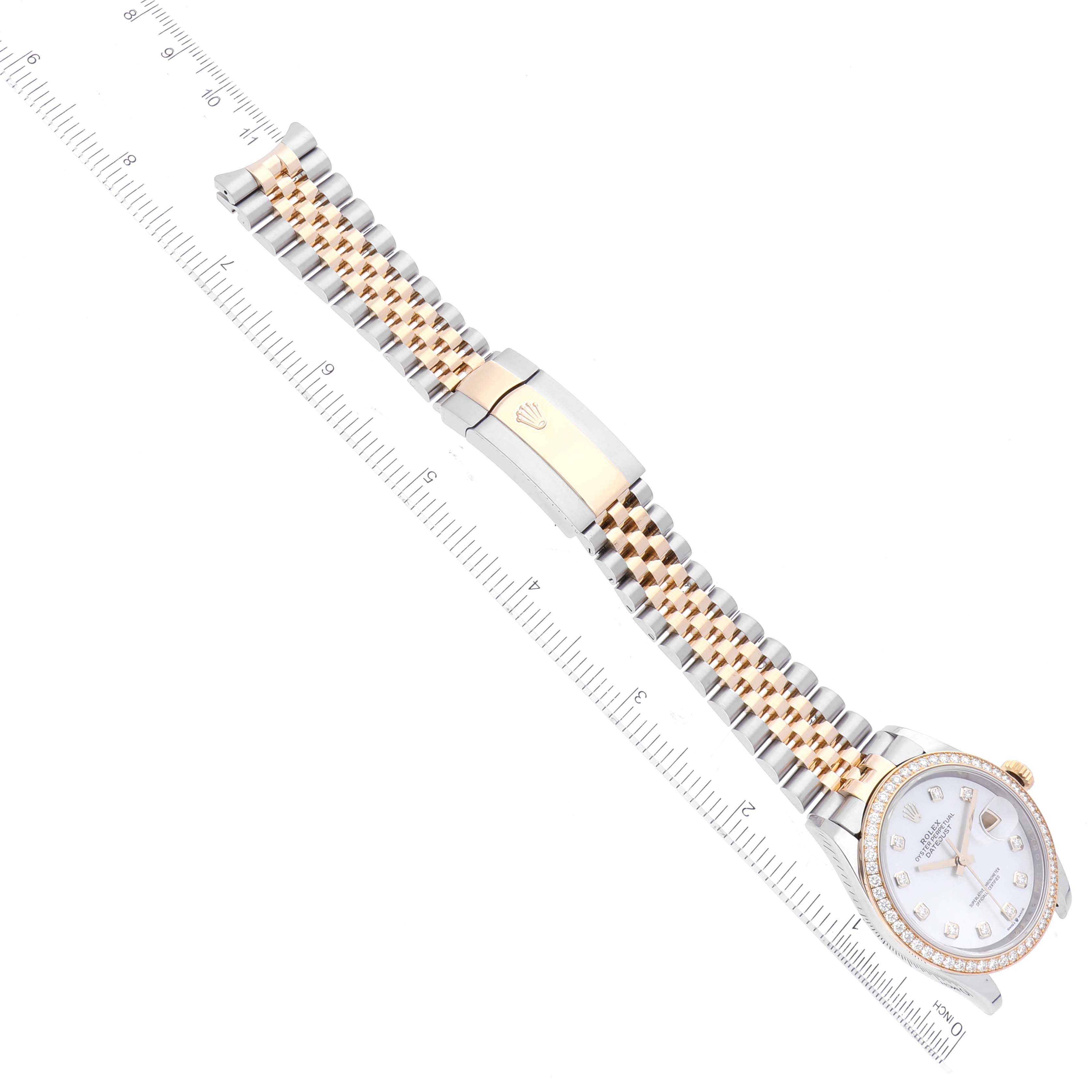 This image shows the Rolex Datejust 126283 Men's Steel and Gold (two tone) Mother of Pearl Dial 126283 Men's Steel and Gold (two tone) Mother of Pearl Dial watch laid flat, showcasing its face, bezel, and Jubilee bracelet with a clasp.