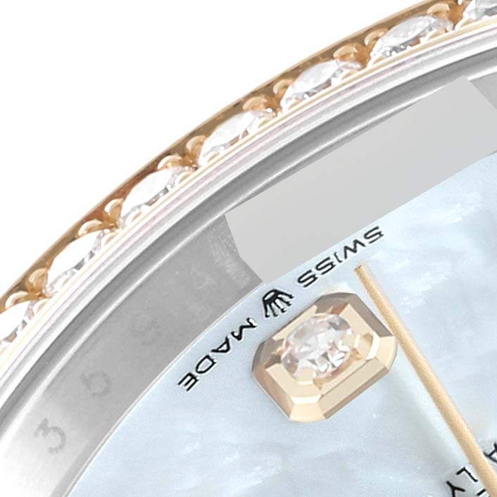 This image shows a close-up of the bezel and part of the dial of a Rolex Datejust 126283 Men's Steel and Gold (two tone) Mother of Pearl Dial 126283 Men's Steel and Gold (two tone) Mother of Pearl Dial watch with diamond accents.