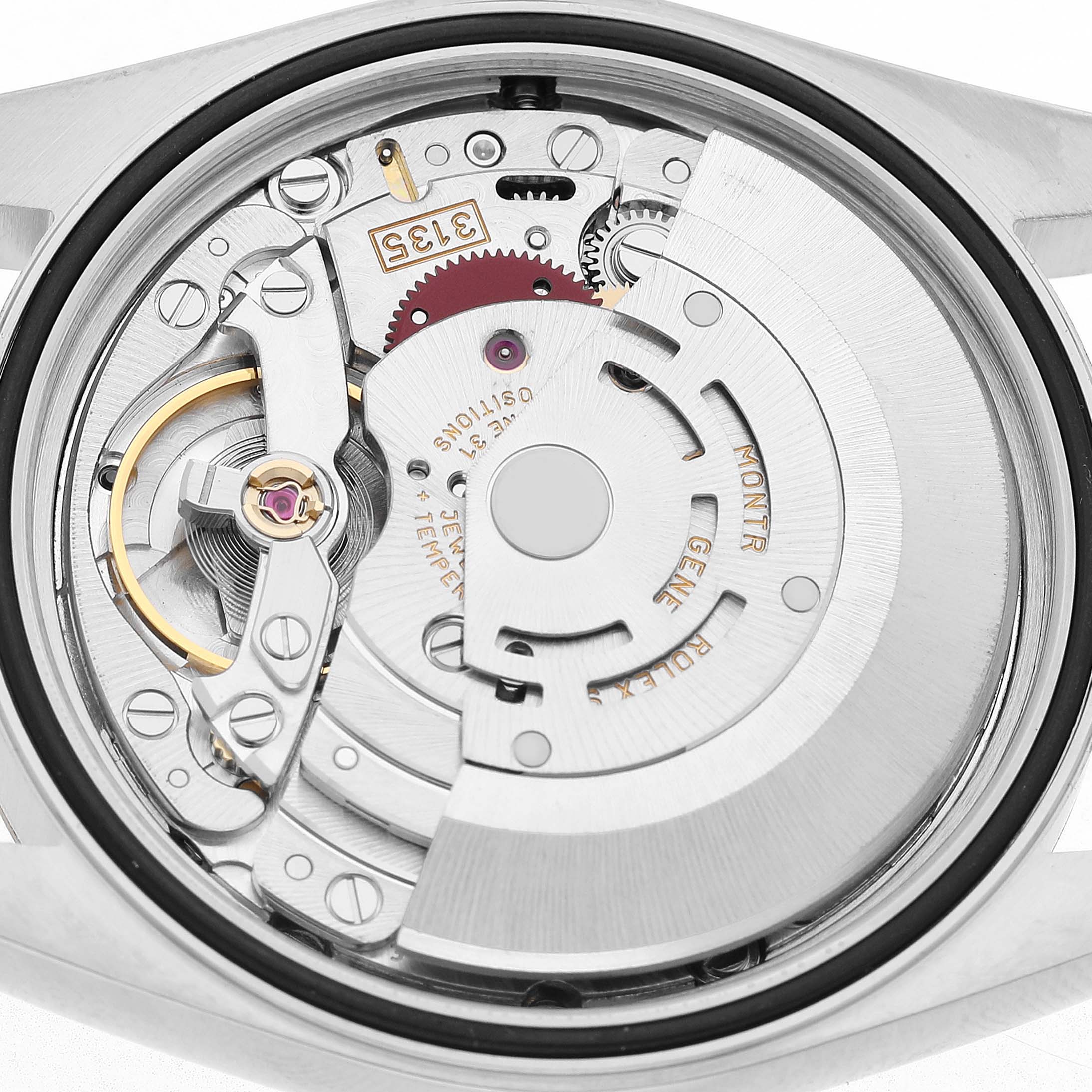The image shows the back view of a Rolex Datejust 16233 Men's Steel and Gold (two tone) White Dial, highlighting its intricate movement mechanism.