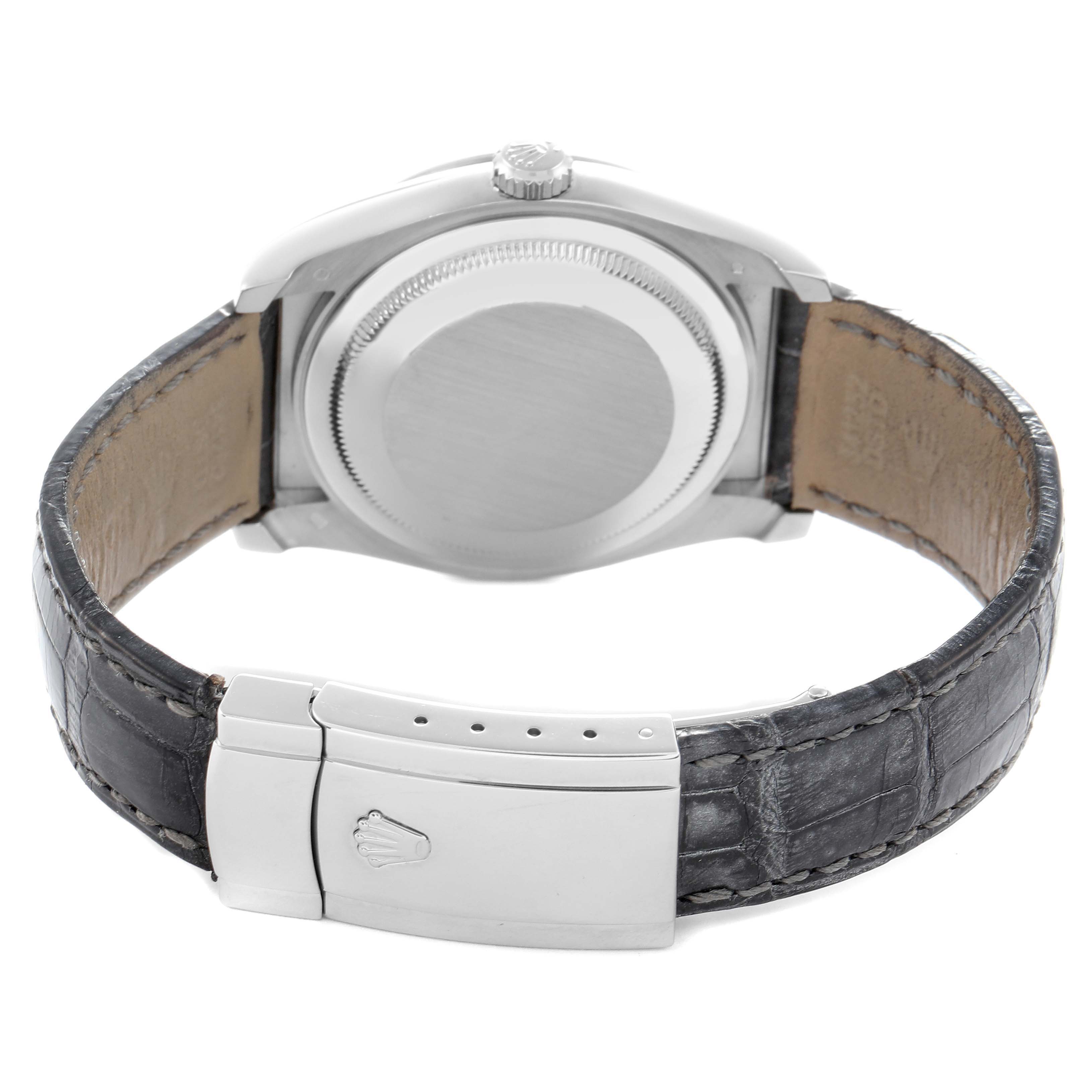 The image shows the back of a Rolex Datejust 116189 Men
s White Gold Pink Dial 116189 Men
s White Gold Pink Dial, highlighting the case back, crown, and leather strap with a clasp.