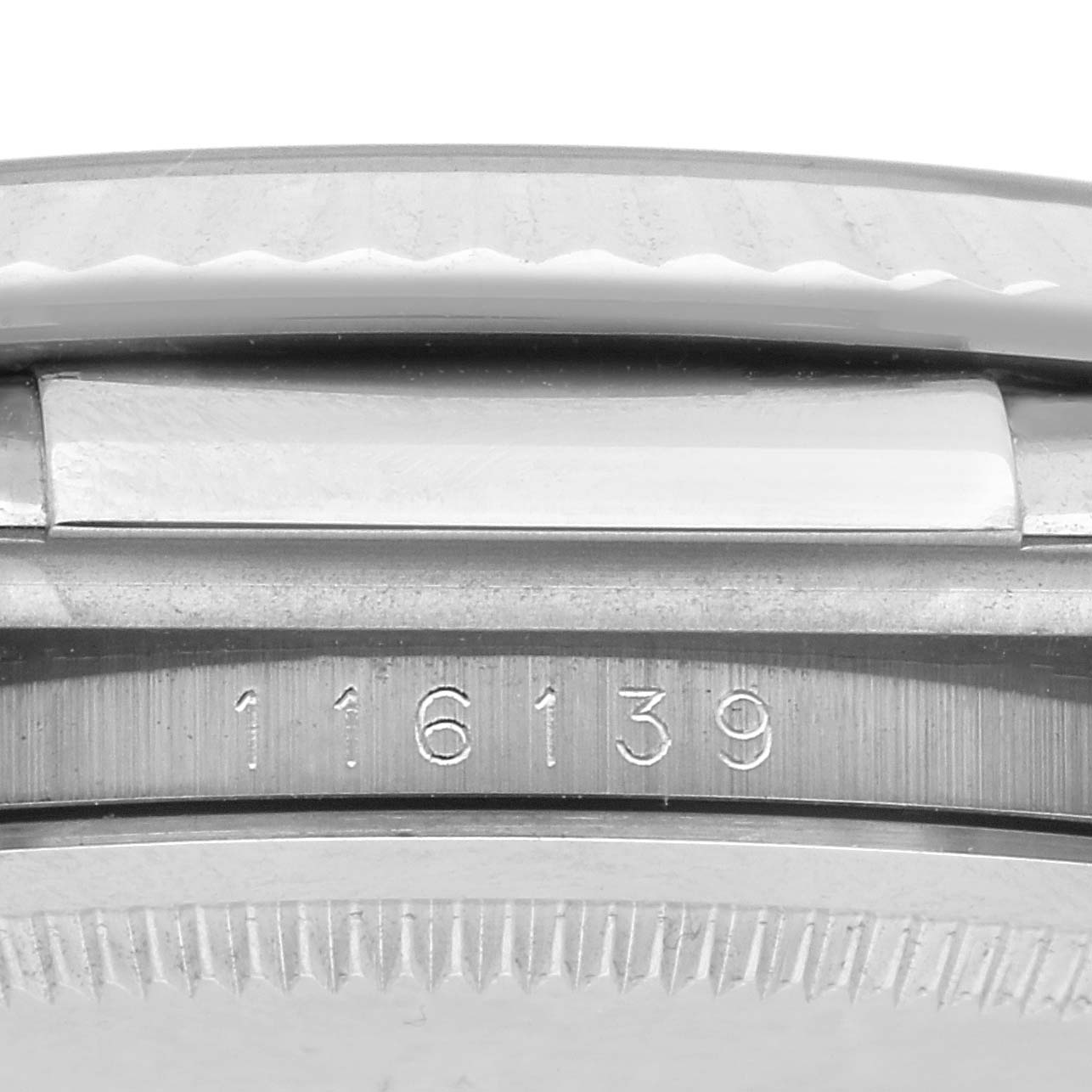 The image shows a close-up of the model number on the caseback edge of a Rolex Datejust 116139 Men's White Gold White Dial 116139 Men's White Gold White Dial watch.