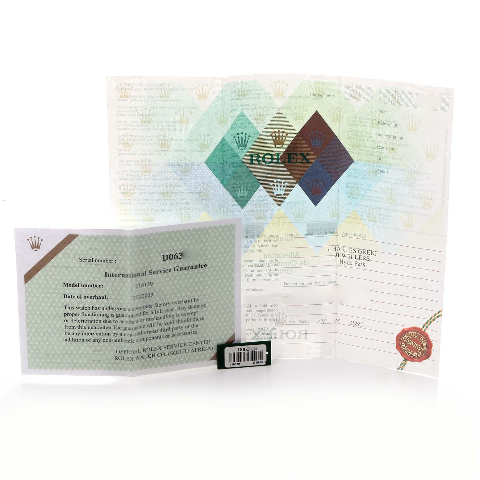 The image shows Rolex Datejust 116139 Men's White Gold White Dial 116139 Men's White Gold White Dial documents, including an International Service Guarantee and other paperwork, displayed flat.