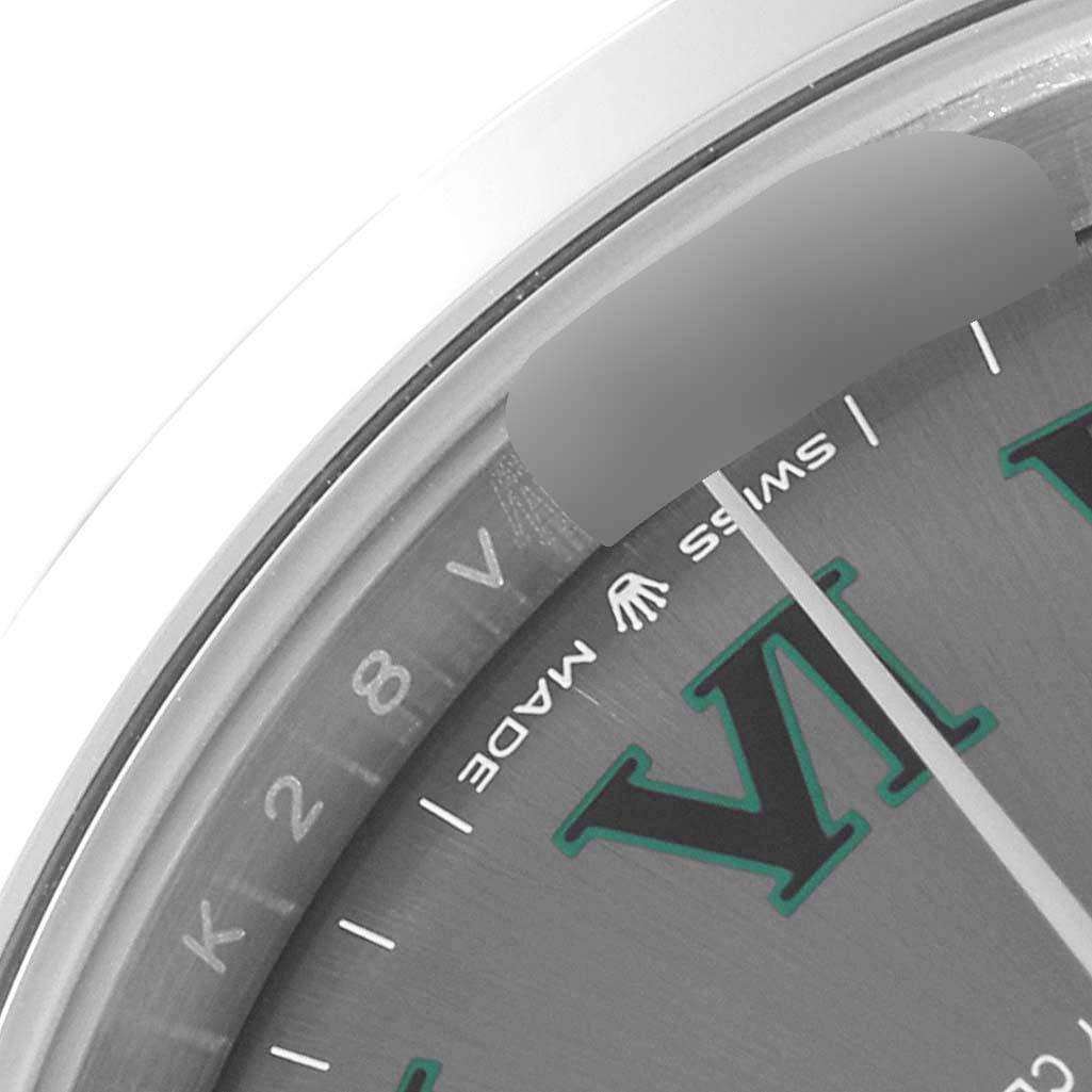 The image shows a close-up of the upper left quadrant of the dial of a Rolex Datejust 41 126300 Men
s Stainless Steel Grey Dial 126300 Men
s Stainless Steel Grey Dial watch, including the "SWISS MADE" text.