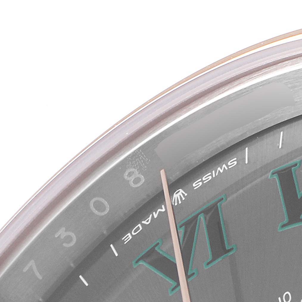 This image shows a close-up of the dial and part of the bezel of a Rolex Datejust 41 126301 Men's Steel and Gold (two tone) Grey Dial 126301 Men's Steel and Gold (two tone) Grey Dial watch, highlighting the VI marker and "SWISS MADE" text.