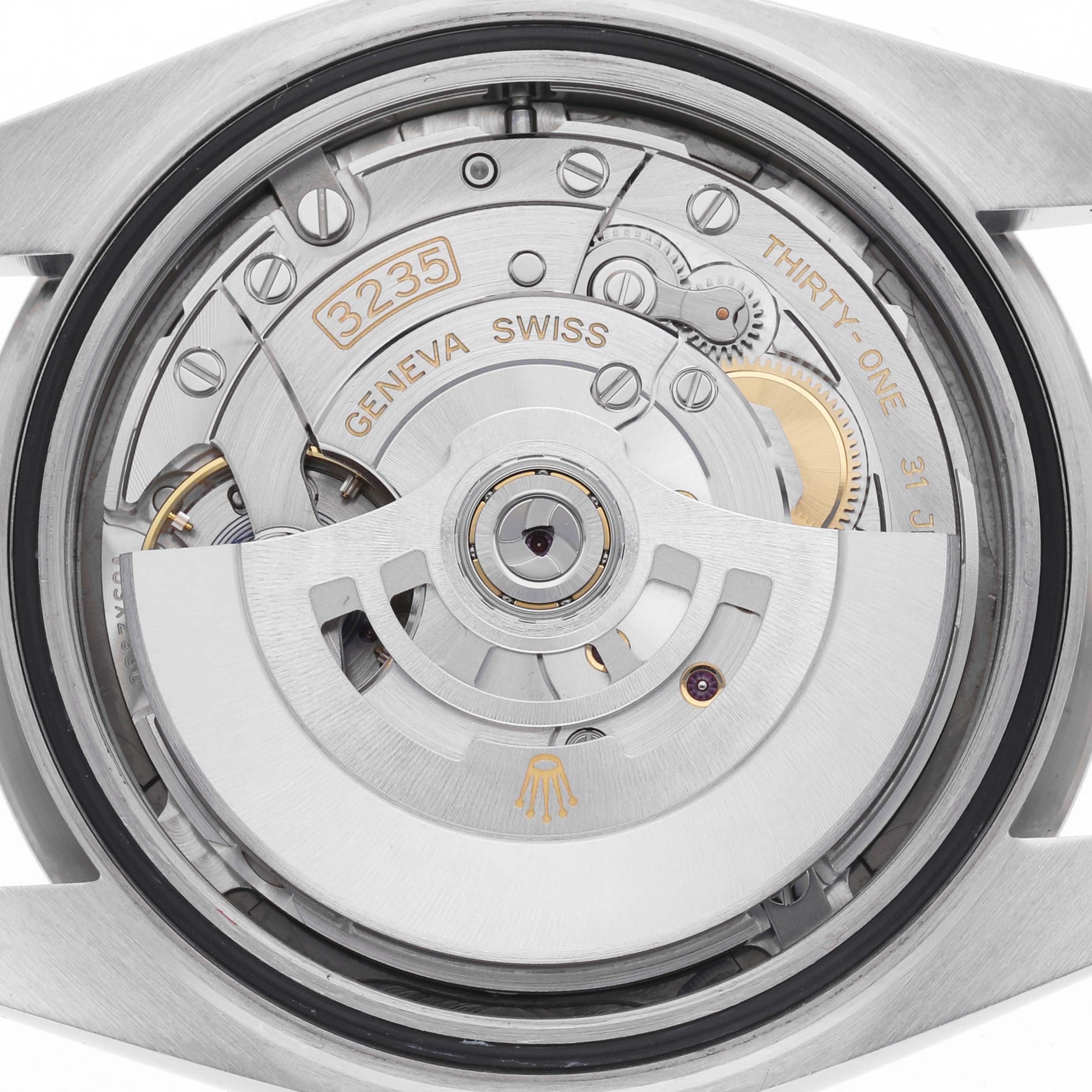 The image shows the movement of a Rolex Datejust 41 126334 Men
s Stainless Steel Grey Dial 126334 Men
s Stainless Steel Grey Dial, focusing on its intricate mechanisms and rotor from the back.