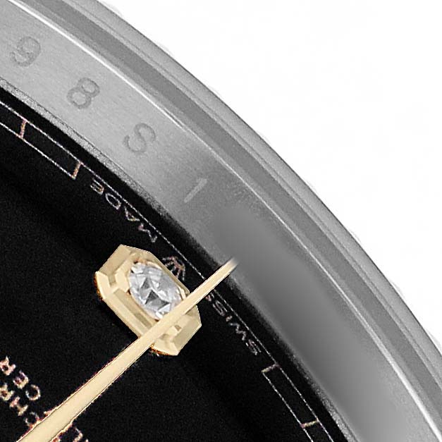The image shows a partial view of a Rolex Datejust 126333 Men's Steel and Gold (two tone) Black Dial, focusing on the dial, hand, and diamond marker.