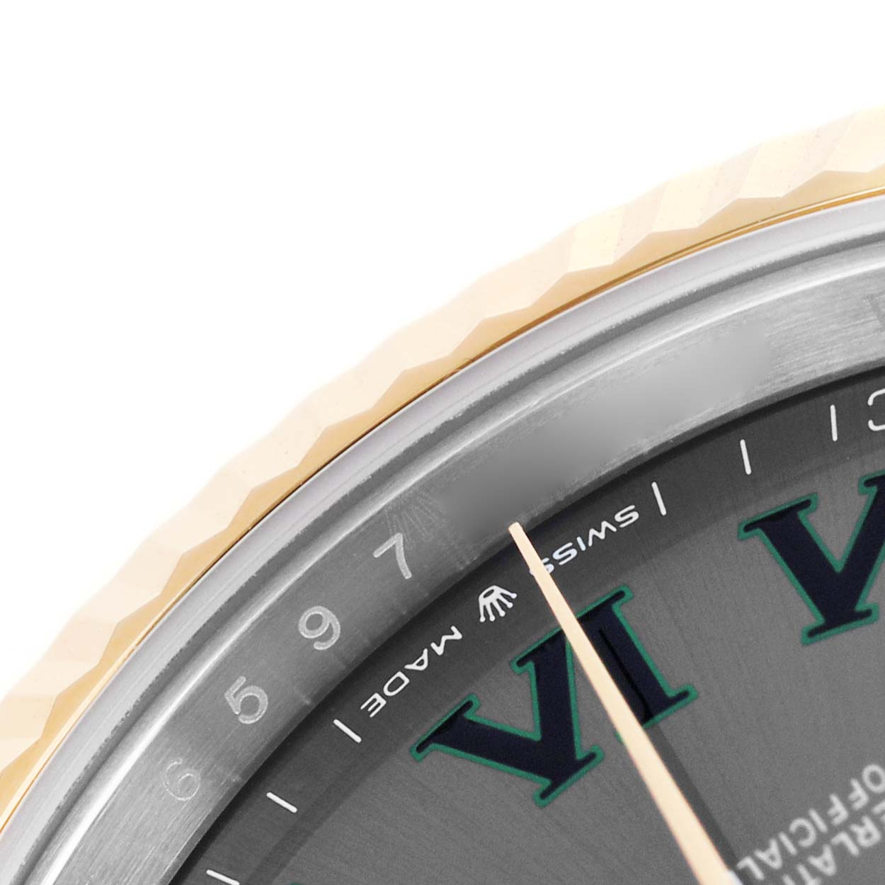 The image shows a close-up of the bezel and part of the dial of a Rolex Datejust 41 126333 Men's Steel and Gold (two tone) Grey Dial, highlighting the fluted bezel and hour markers.