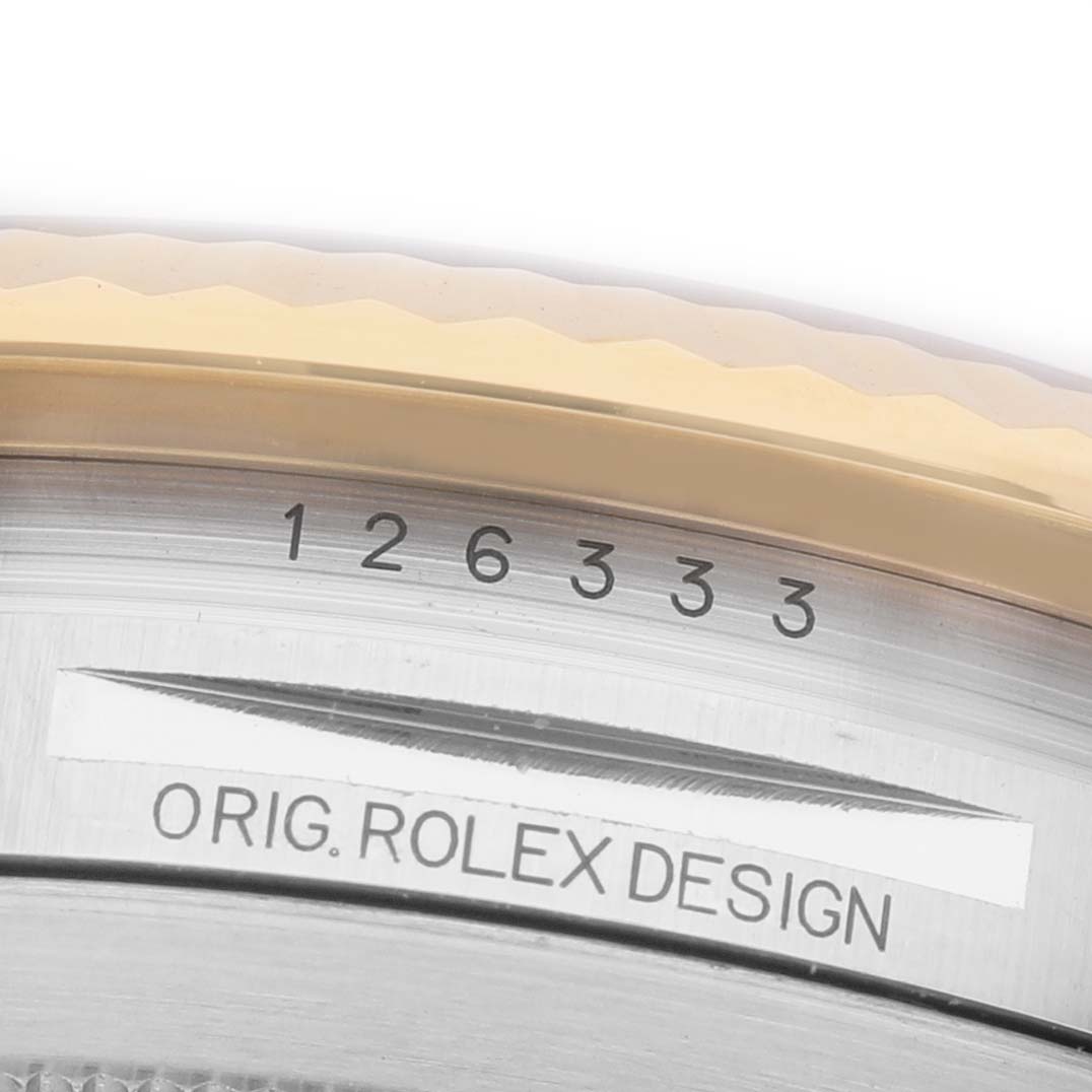 The image shows a close-up of the Rolex Datejust 41 126333 Men's Steel and Gold (two tone) Grey Dial's case border, highlighting the serial number and "Orig. Rolex Design" engraving.