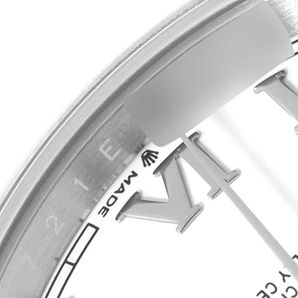 This image shows a close-up of the dial, bezel, and hour hand of the Rolex Datejust 41 126300 Men's Stainless Steel White Dial 126300 Men's Stainless Steel White Dial watch.