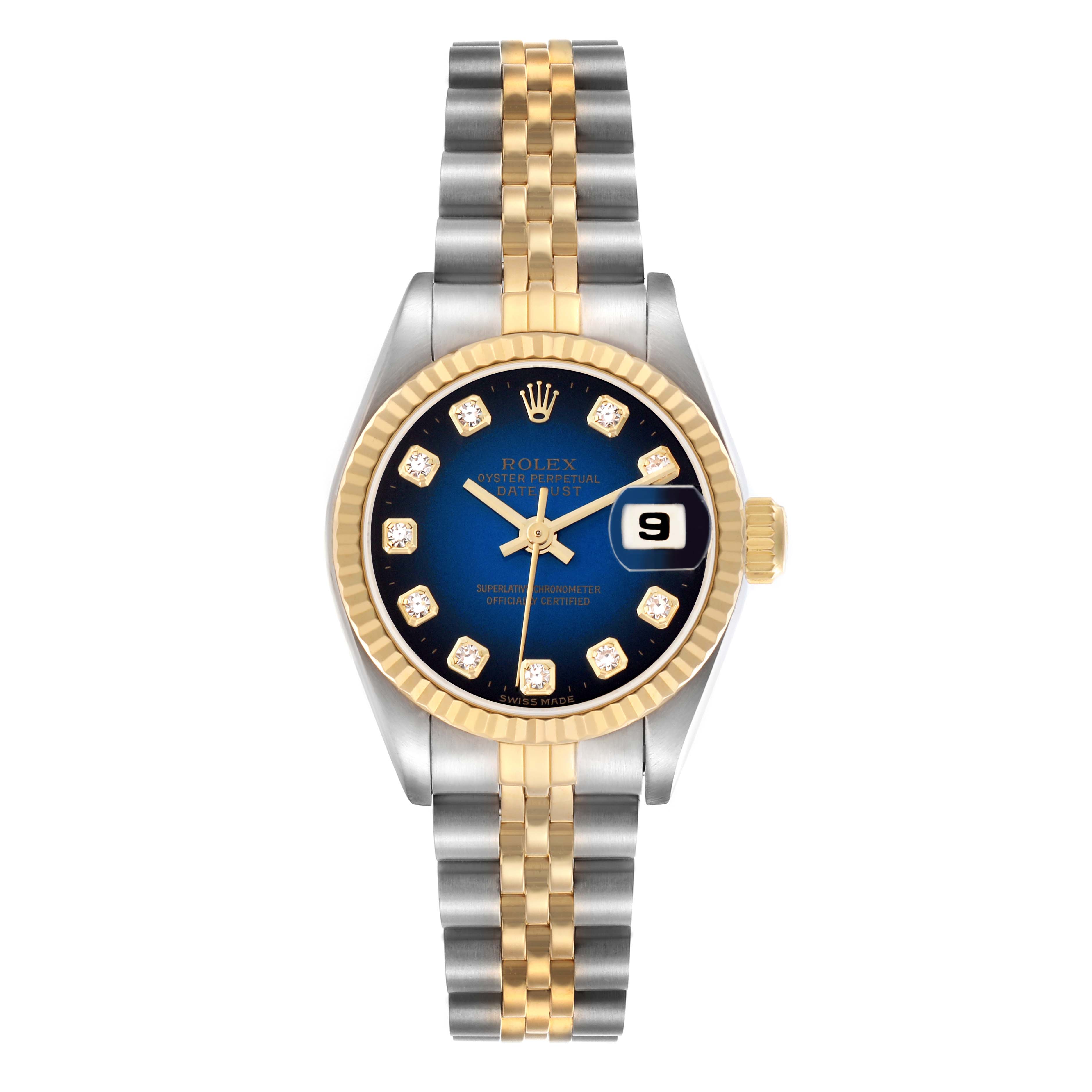 The Rolex Datejust 69173 Women
s Steel and Gold (two tone) Blue Dial 69173 Women
s Steel and Gold (two tone) Blue Dial watch is shown from a top-down angle, featuring a two-tone bracelet, fluted bezel, and a blue dial with diamond markers.