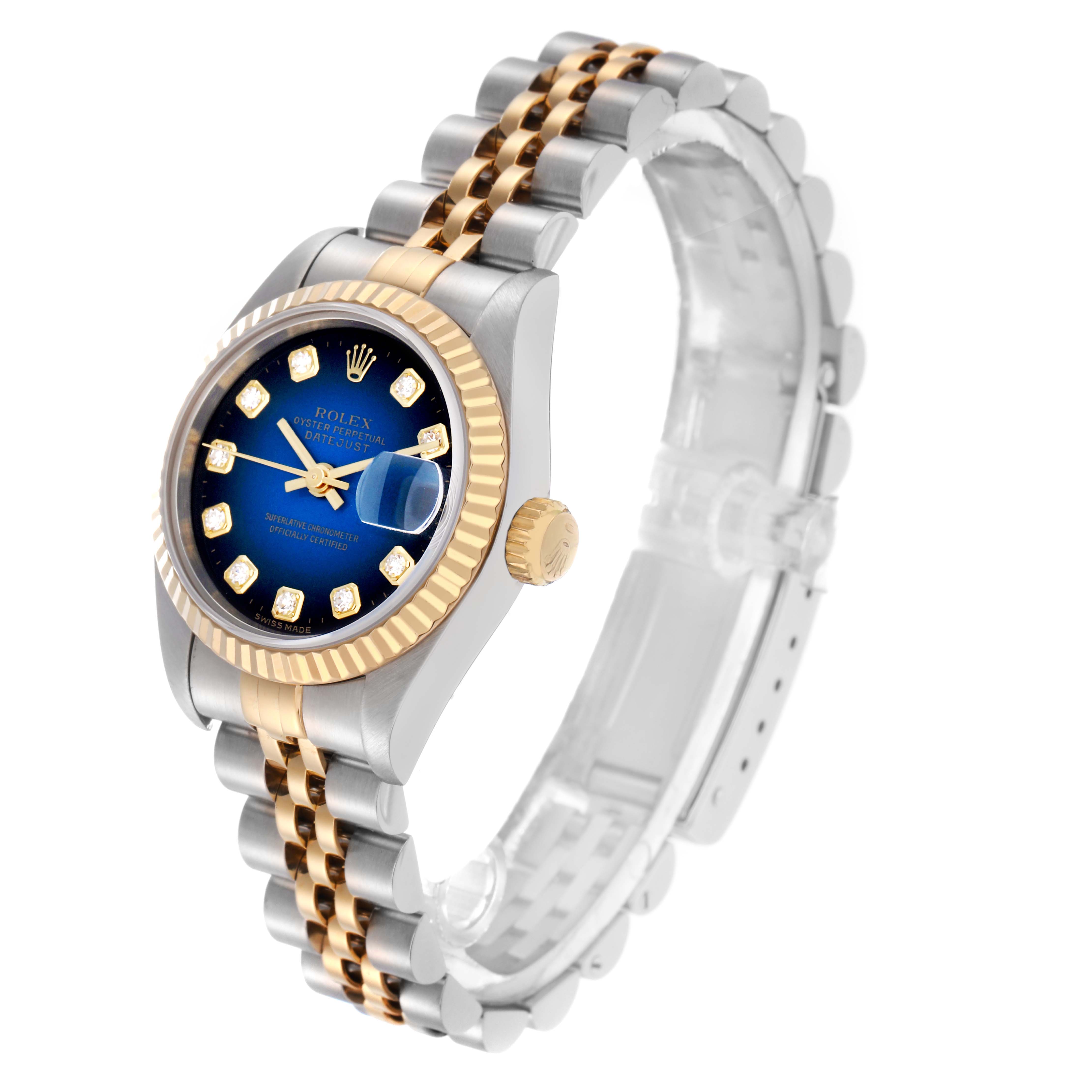 The Rolex Datejust 69173 Women
s Steel and Gold (two tone) Blue Dial 69173 Women
s Steel and Gold (two tone) Blue Dial watch is angled to show the face, crown, bezel, and part of the two-tone bracelet.