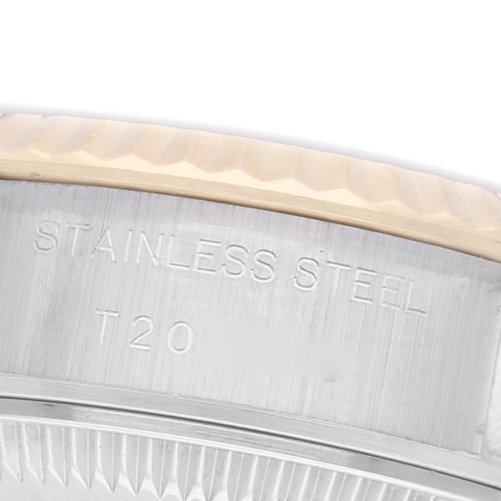 The image shows a close-up of the side engraving on a Rolex Datejust 69173 Women
s Steel and Gold (two tone) Blue Dial 69173 Women
s Steel and Gold (two tone) Blue Dial
s bezel and case, highlighting the "Stainless Steel" text.