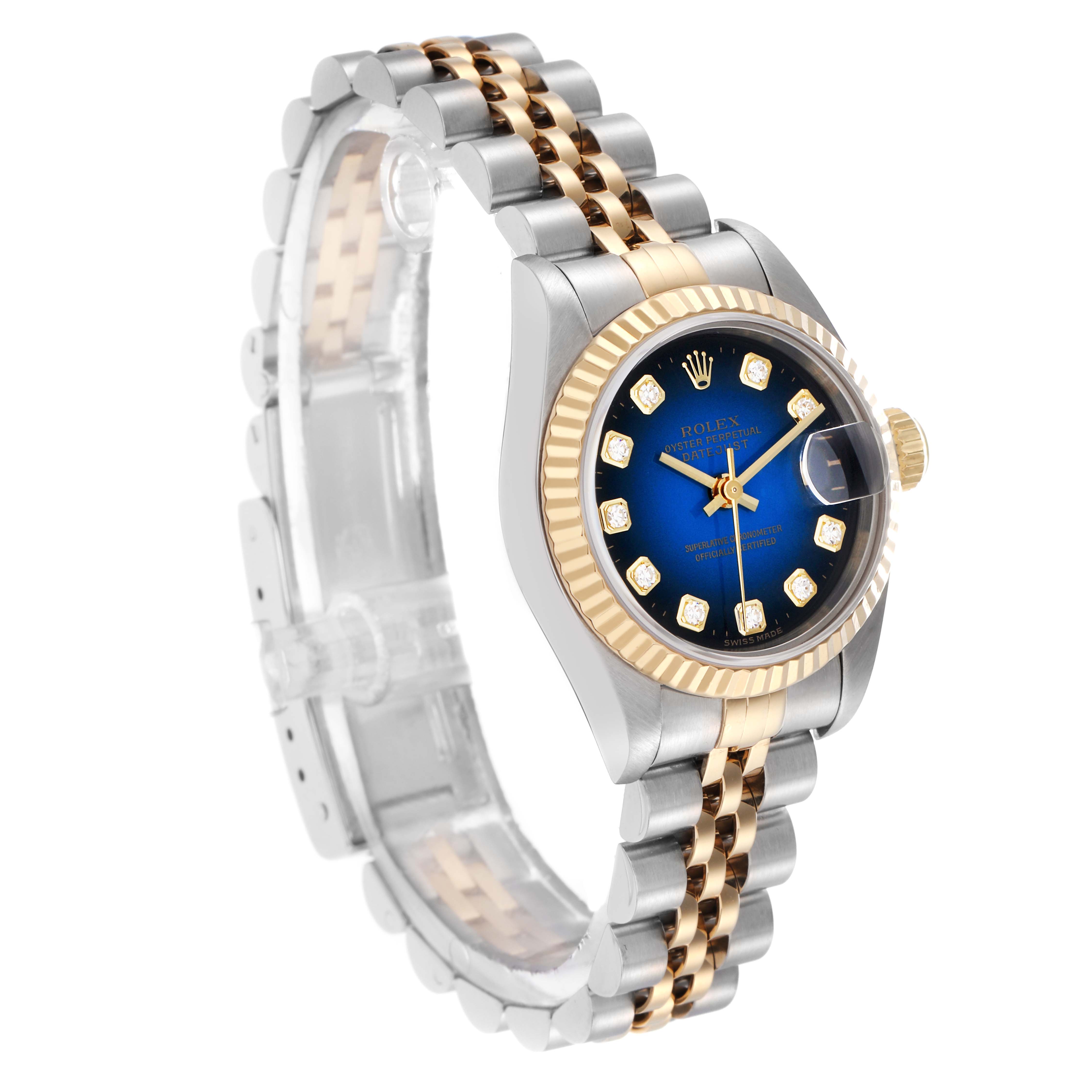 The Rolex Datejust 69173 Women
s Steel and Gold (two tone) Blue Dial 69173 Women
s Steel and Gold (two tone) Blue Dial watch is shown at a three-quarter angle, highlighting its blue dial, diamond markers, and two-tone bracelet.