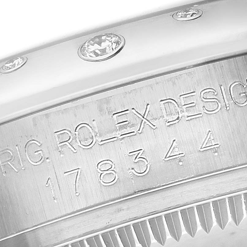 The image shows a close-up of the side engraving and bezel of a Rolex Datejust 178344 Women's Stainless Steel Mother of Pearl Dial watch, highlighting the model number and diamond accents.
