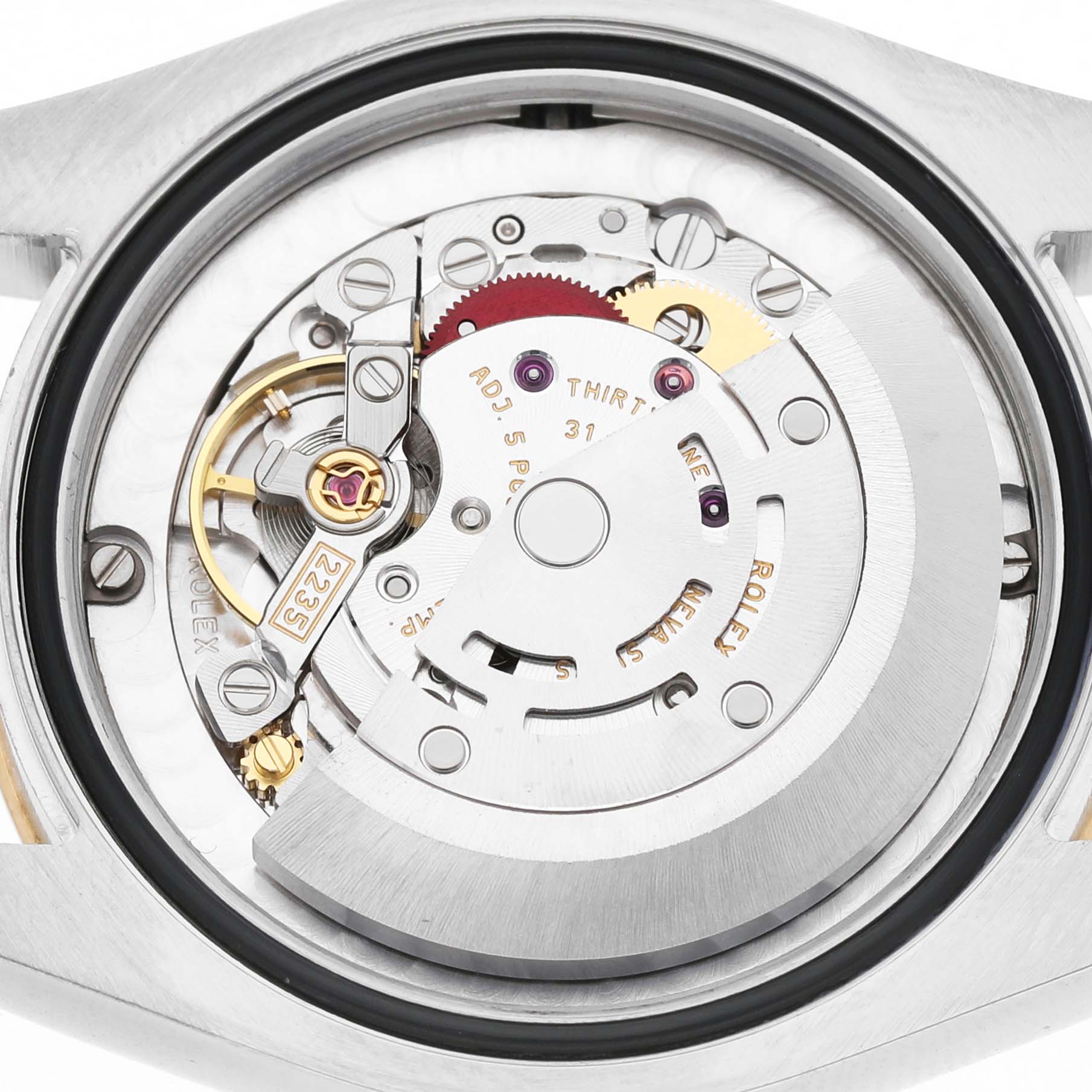 The image shows an inside view of the movement of a Rolex Datejust 178273 Women's Steel and Gold (two tone) Champagne Dial watch, featuring gears and components.