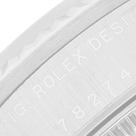 This image shows a close-up of the engraved text on the side of a Mid-Size Rolex watch case.