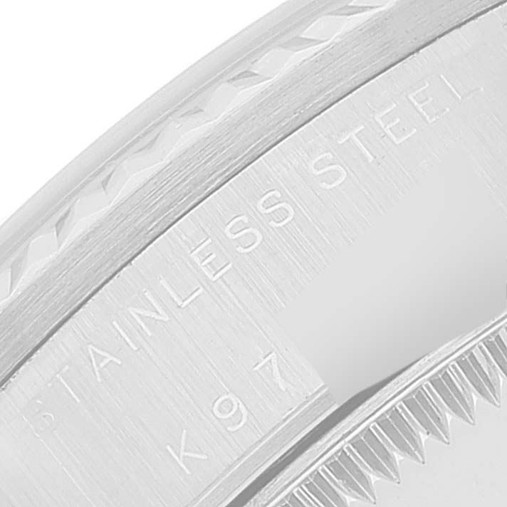 This close-up angle of the Rolex Mid-Size 78274 Women
s Stainless Steel Silver Dial 78274 Women
s Stainless Steel Silver Dial model shows part of the stainless steel casing with etched text.