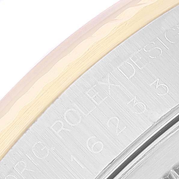 This image shows a close-up of the engraved text on the side of the Rolex Datejust 16233 Men's Steel and Gold (two tone) Champagne Dial 16233 Men's Steel and Gold (two tone) Champagne Dial watch case.