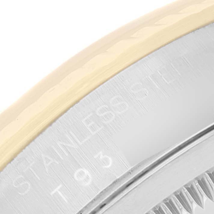 This close-up image shows a portion of the bezel and case, highlighting the stainless steel and gold materials of the Rolex Datejust 16233 Men's Steel and Gold (two tone) Champagne Dial 16233 Men's Steel and Gold (two tone) Champagne Dial watch.