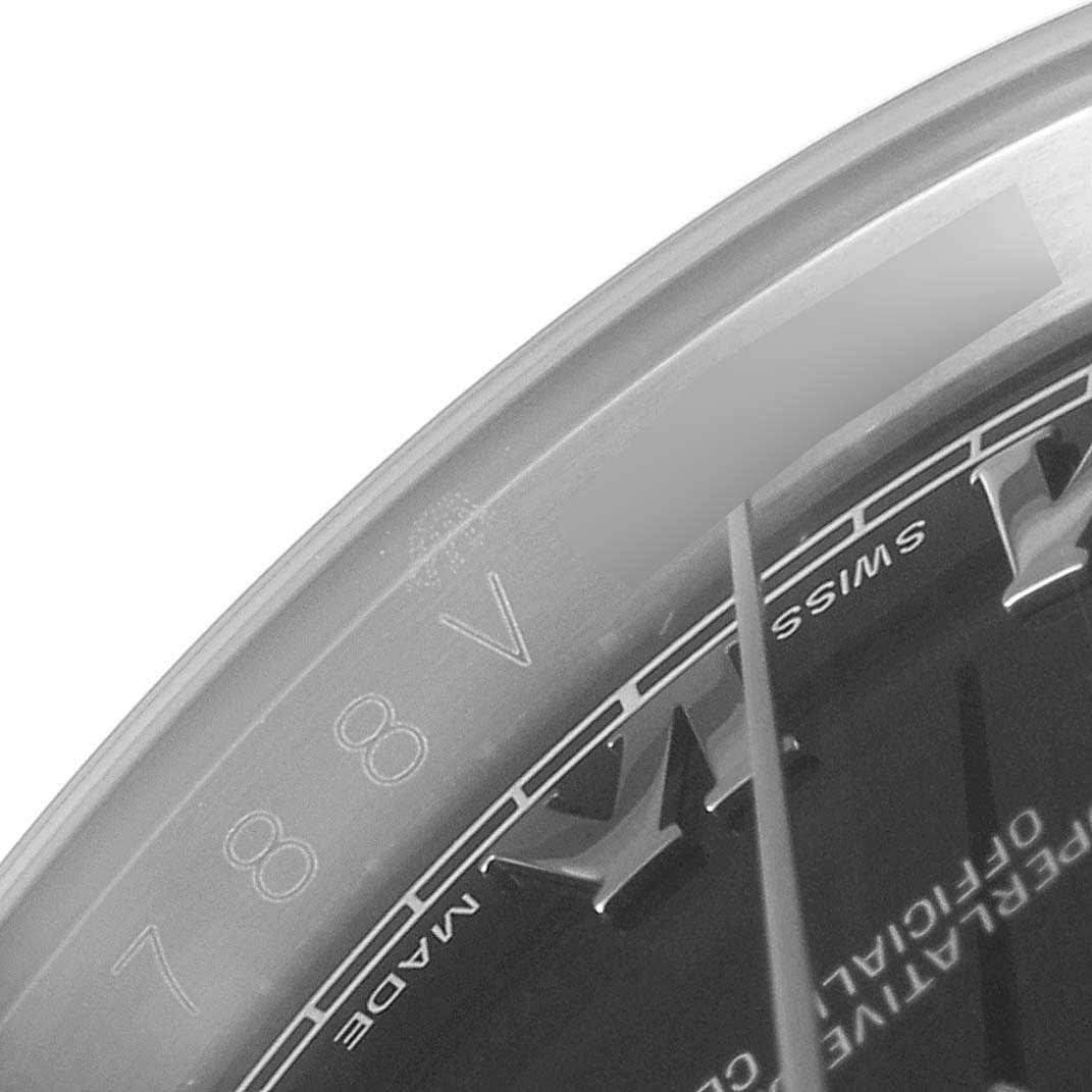 This image shows a close-up of the dial, bezel, and part of the Roman numeral markers of a Rolex Datejust 116234 Men
s Stainless Steel Black Dial 116234 Men
s Stainless Steel Black Dial watch.