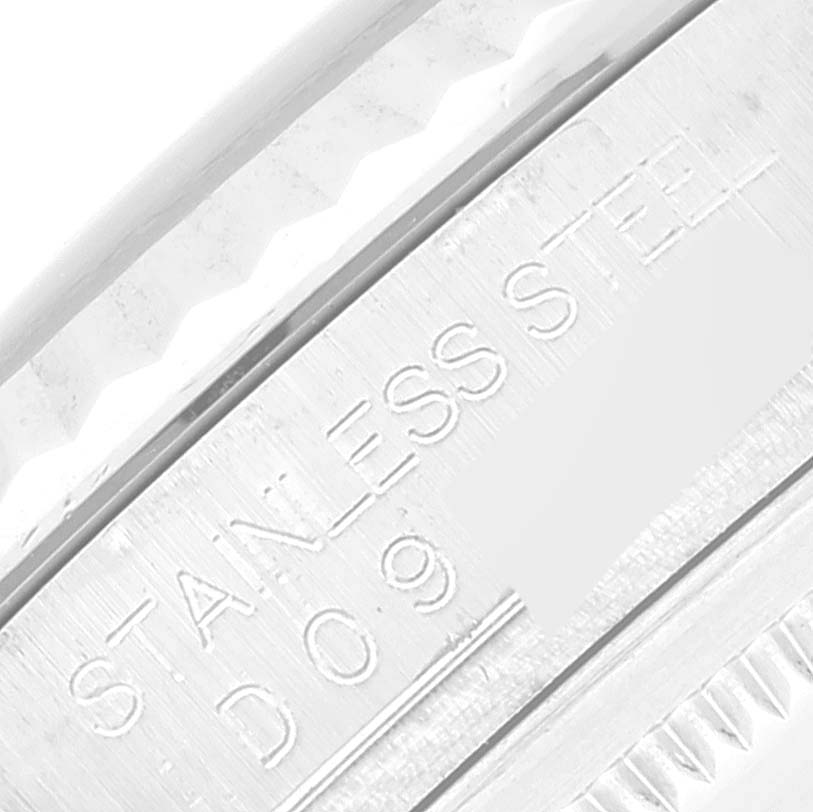 This close-up image shows the stainless steel engraving on the side of a Rolex Datejust 116234 Men's Stainless Steel Black Dial 116234 Men's Stainless Steel Black Dial watch case.