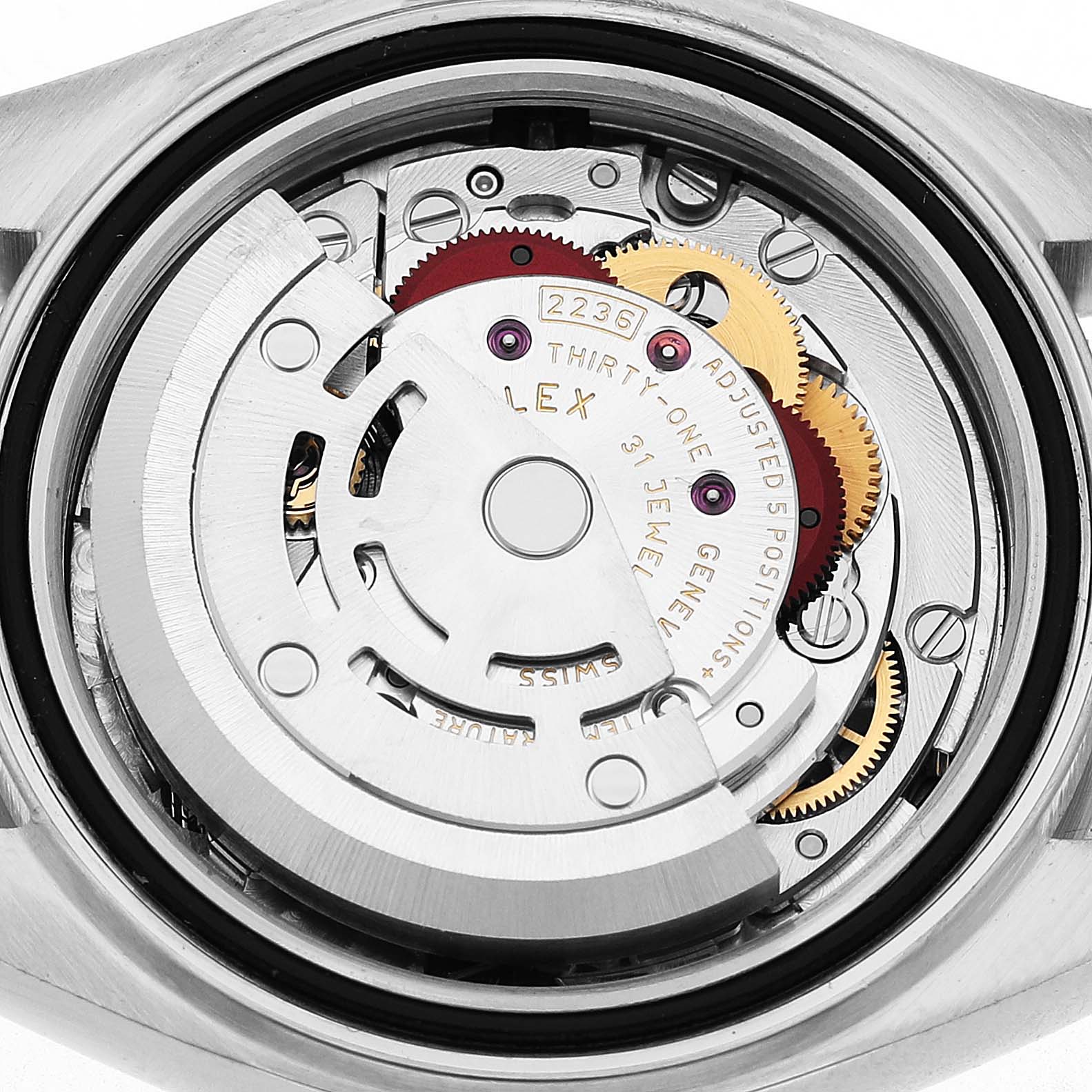 The image shows the movement of a Rolex Datejust 279174 Women's Stainless Steel Mother of Pearl Dial, highlighting the automatic rotor and gears from the back angle.