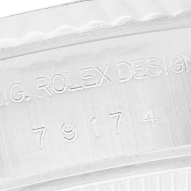This image shows a close-up of the inner case engraving on a Rolex Datejust 79174 Women
s Stainless Steel Mother of Pearl Dial 79174 Women
s Stainless Steel Mother of Pearl Dial watch.