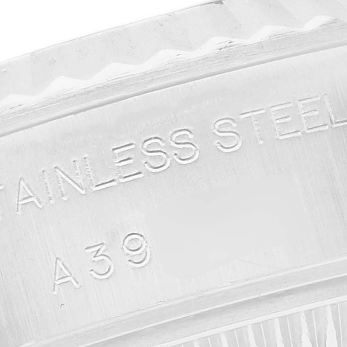 The image shows a close-up of the inner rim of a Rolex Datejust 79174 Women
s Stainless Steel Mother of Pearl Dial 79174 Women
s Stainless Steel Mother of Pearl Dial watch, focusing on engraved details.