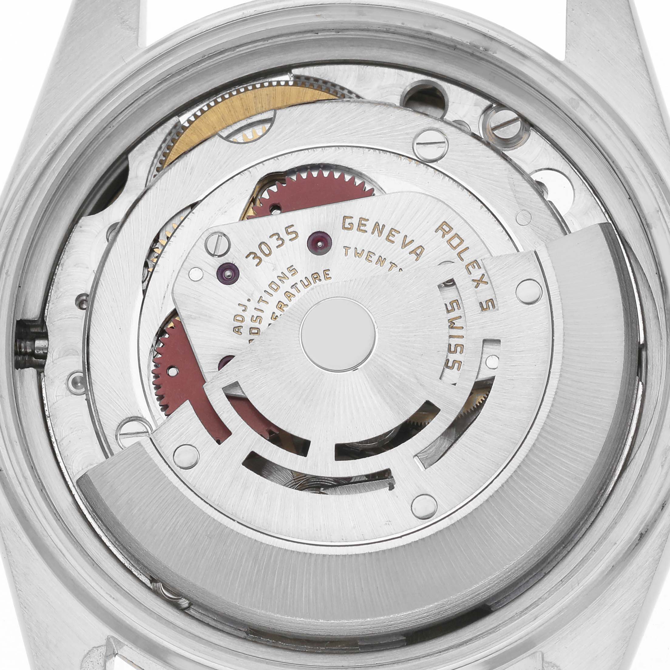 The image shows a close-up view of the movement inside a Vintage Collection Rolex watch, highlighting the rotor and mechanical parts.