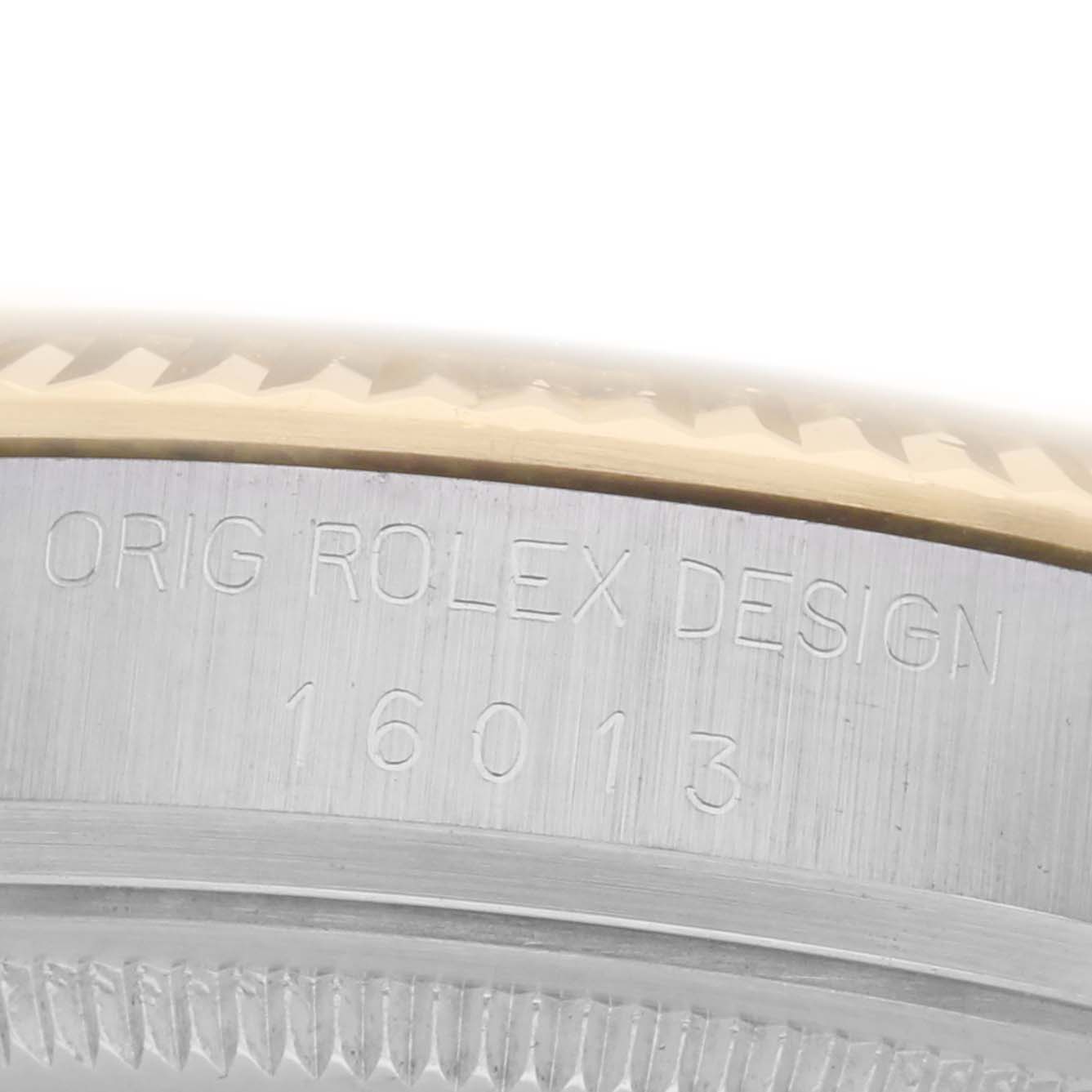 This image shows a close-up of the side of a Rolex Vintage Collection 16013 Men
s Steel and Gold (two tone) Black Dial 16013 Men
s Steel and Gold (two tone) Black Dial model, highlighting the engraved "ORIG ROLEX DESIGN" and model number "16013".