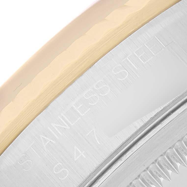 This image shows a close-up angle of the bezel and case of the Rolex Datejust 16233 Men's Steel and Gold (two tone) Champagne Dial 16233 Men's Steel and Gold (two tone) Champagne Dial watch, highlighting its stainless steel and markings.