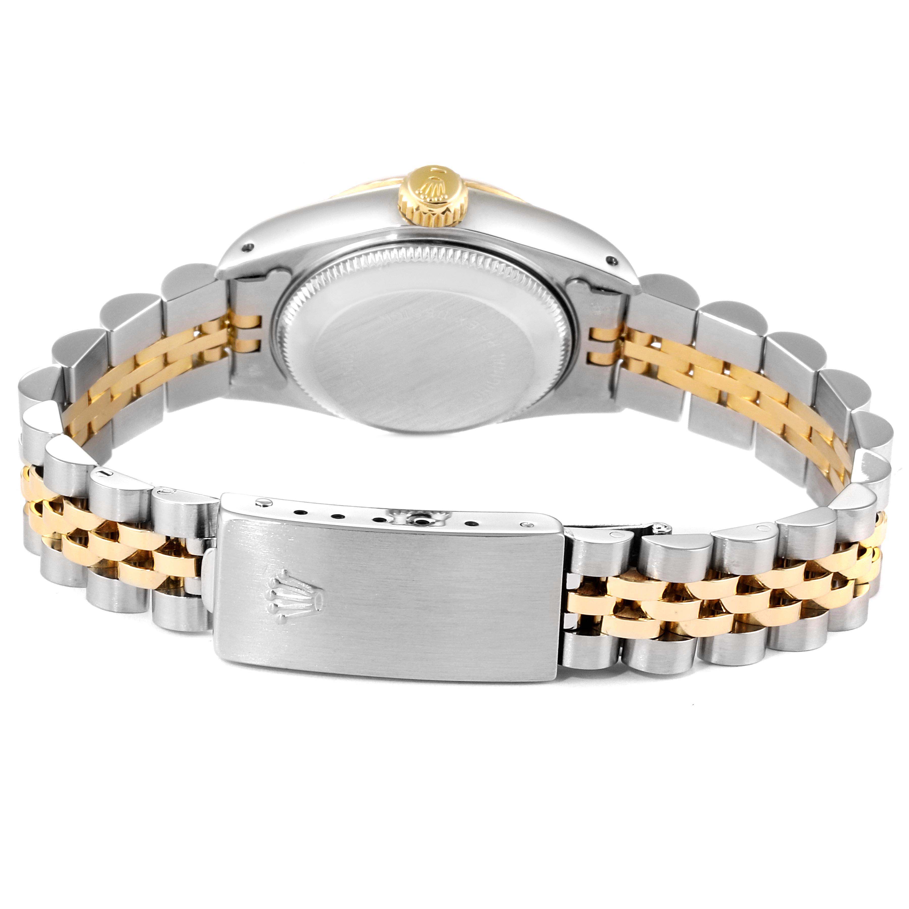 This image shows the back view of a Rolex Datejust 69173 Women
s Steel and Gold (two tone) Champagne Dial 69173 Women
s Steel and Gold (two tone) Champagne Dial watch, highlighting the case back, crown, and two-tone bracelet with a clasp.