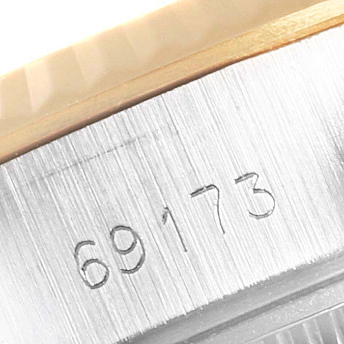 This image shows a close-up of the case side with the serial number of a Rolex Datejust 69173 Women
s Steel and Gold (two tone) Champagne Dial 69173 Women
s Steel and Gold (two tone) Champagne Dial watch.